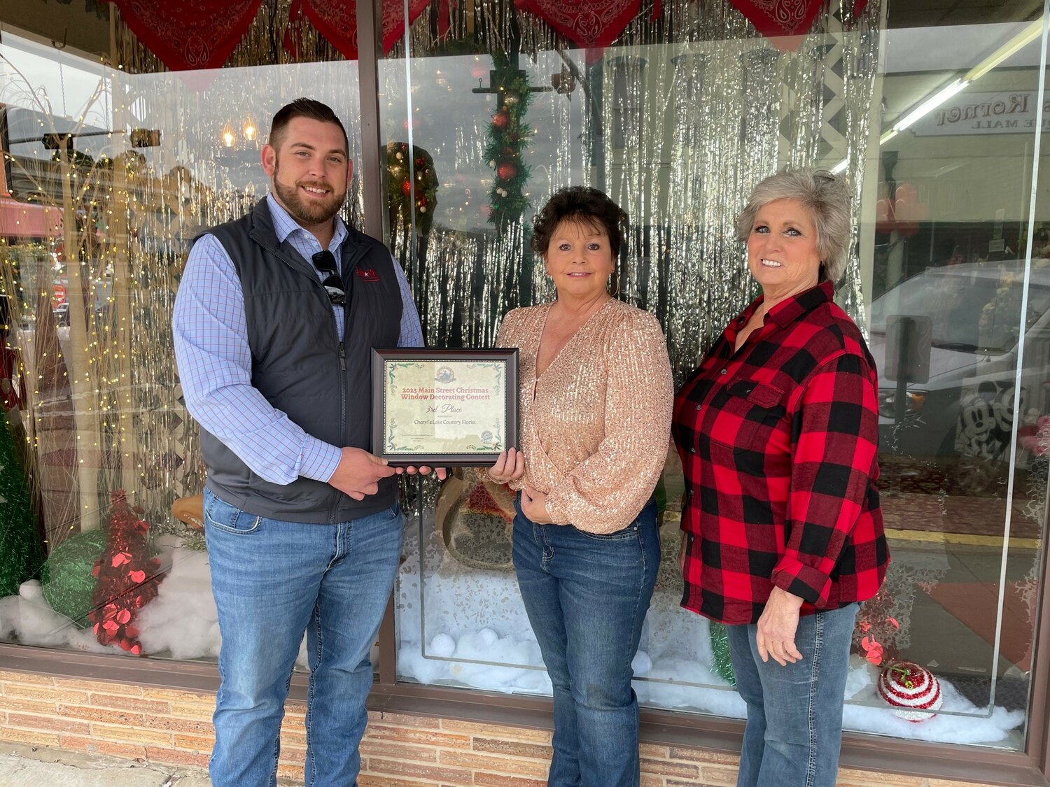 Main Street Chairman Nic Watkins presented the certificate to owner Cheryl Wood and her assistant Rose Petra.